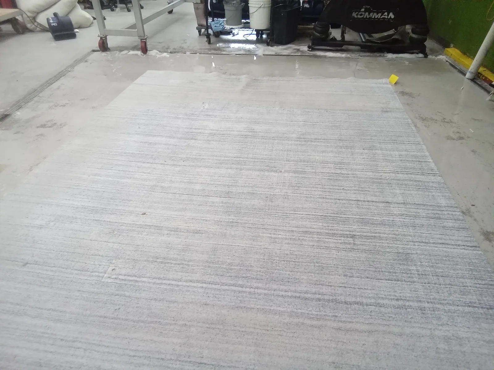 A rug laid out at the plant, in for cleaning from Pinecrest